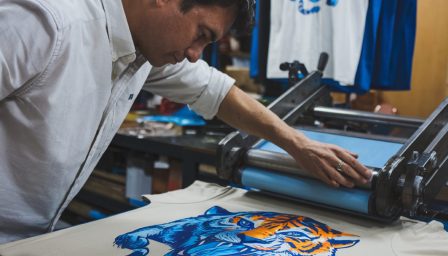 man-is-painting-lion-shirt-that-says-tiger